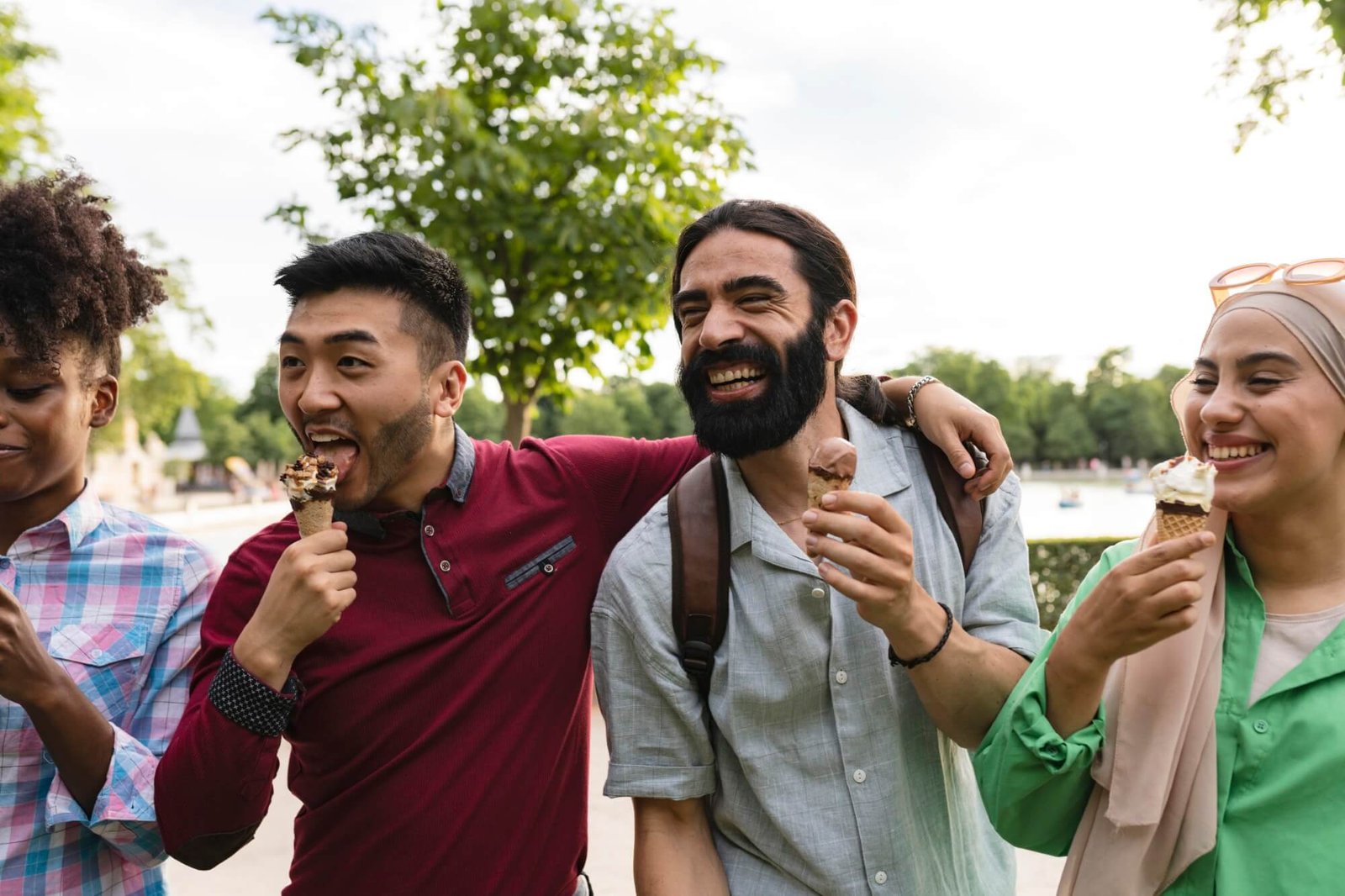 young multiracial travelers in the park eating ice 2025 02 22 18 14 16 utc.jpg